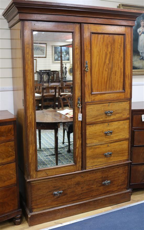 An Edwardian mahogany compactum wardrobe W.132cm